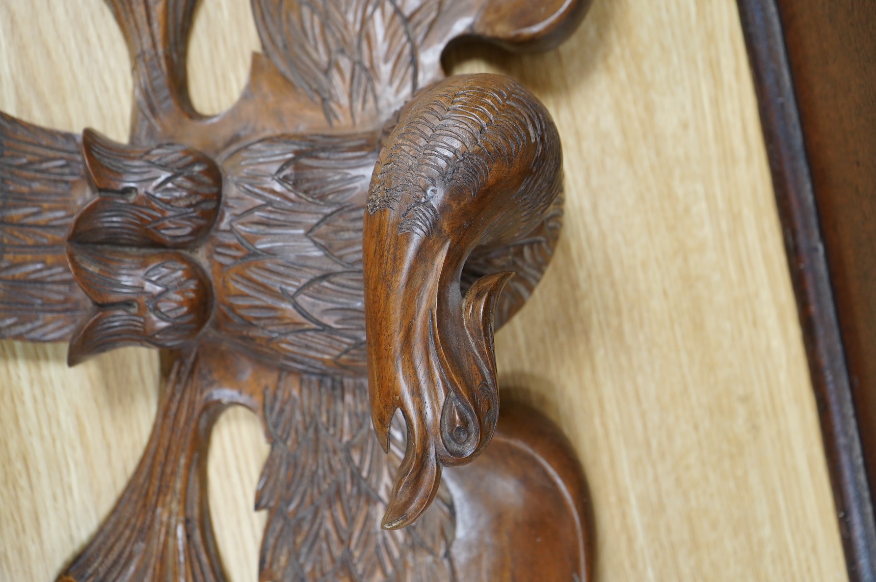 A mahogany leather-handled tool box and carved American eagle wall mount, largest 66cm wide